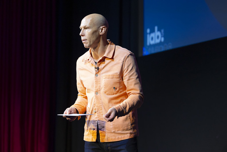 James speaking on stage