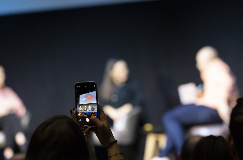 A mobile phone pointed at the stage