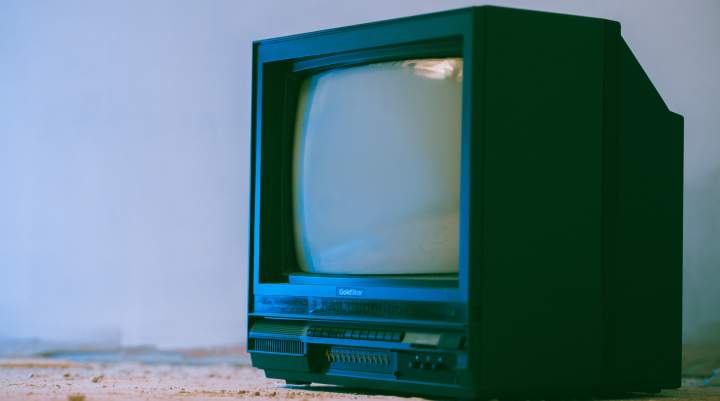 TV sitting on beach 