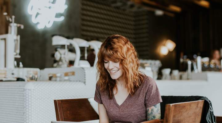 Woman sitting in a cafe on a laptop