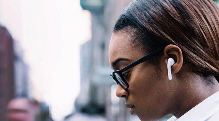 Person listening to speakers