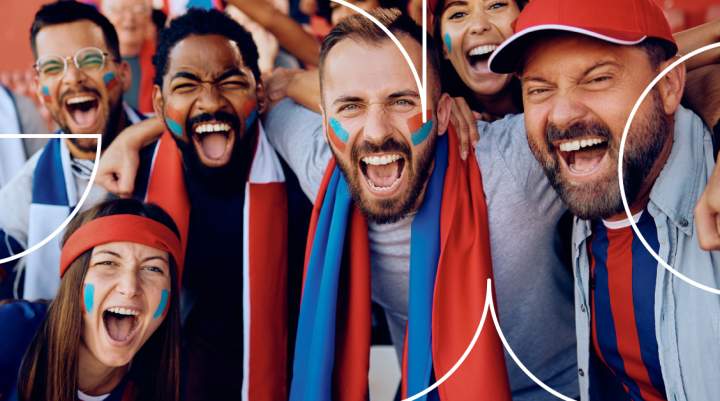 Sports fans smiling at camera