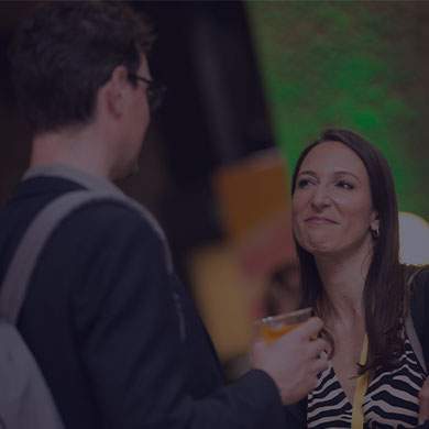 stock photo of woman talking to man who is holding a cup