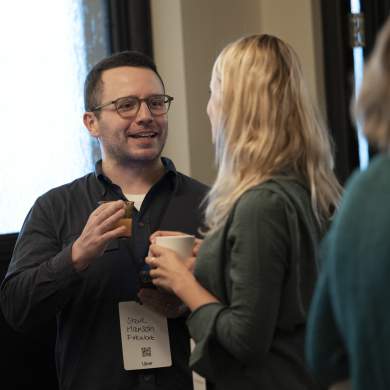 A picture of a man and woman drinking coffee