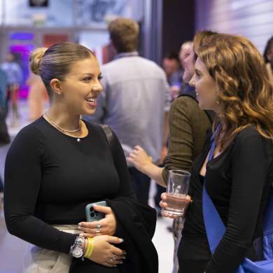 Two woman engaged in conversation