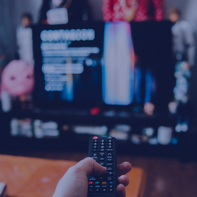 Person using remote control on a connected television
