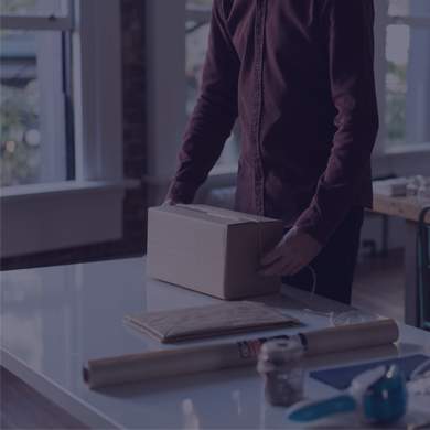 person wrapping a box