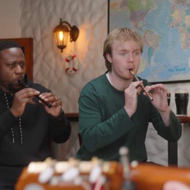 Two people playing flutes