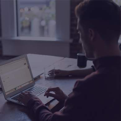 A person typing at a computer