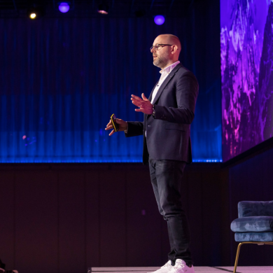 Jon Mew speaking on stage at IAB event