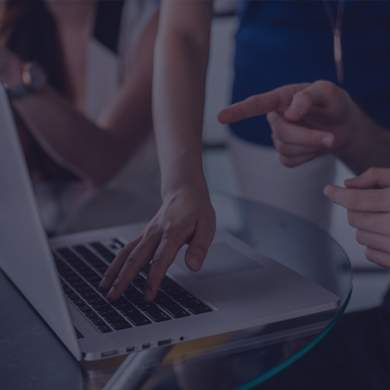 People looking at a computer