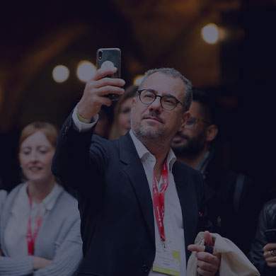 stock image of man taking photo of something out of shot