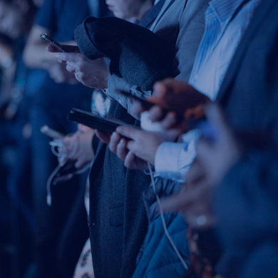 Row of people using smartphones