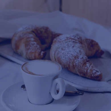A picture of a cappuccino and croissants