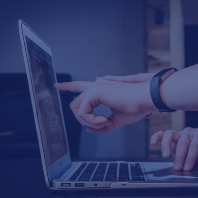 People pointing at a computer screen