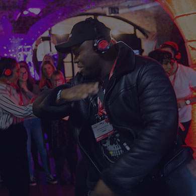 Stock image of man dancing and listening to a podcast