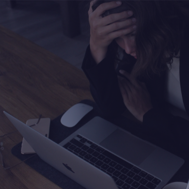 Stressed out person at a computer