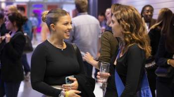 Two woman engaged in conversation 