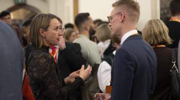 members chatting at IAB event