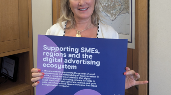 Caroline Dinenage, MP for Gosport, holding up IAB UK pledge