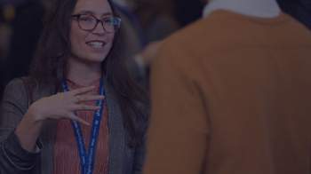 Stock image of woman talking to man