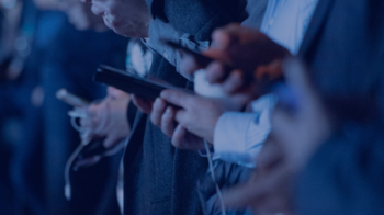 Row of people using smartphones