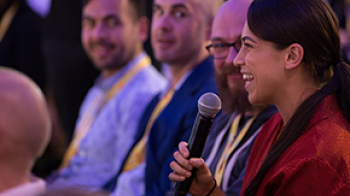 Woman-happy-during-programamtic-talk