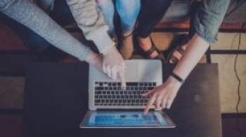 People pointing at a screen