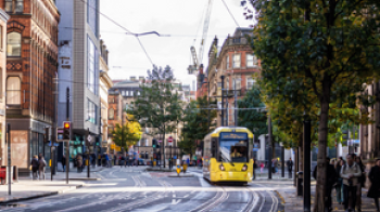 Tram rolling through Manchester city centre