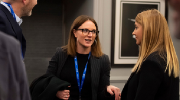 Attendees chatting at iab event