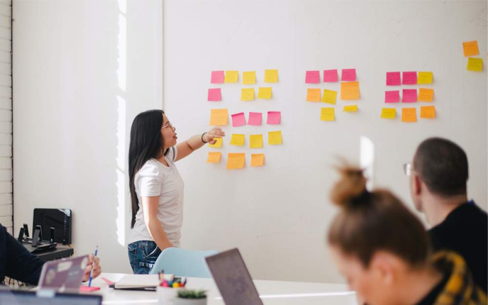 person standing at a white board