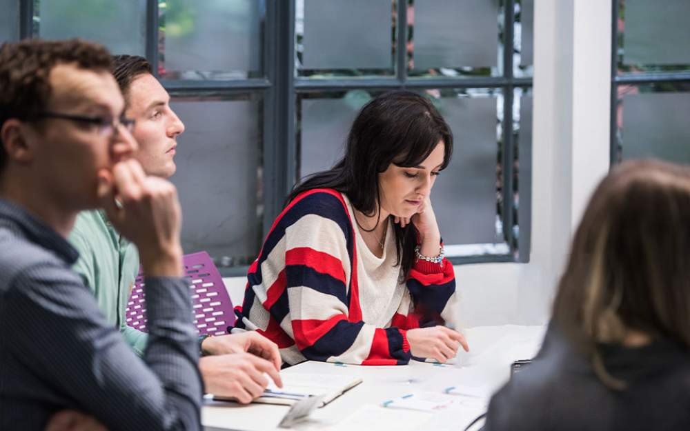 Stock image of various people working at a desk